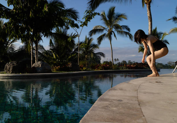 Reflection of palm trees over swimming pool