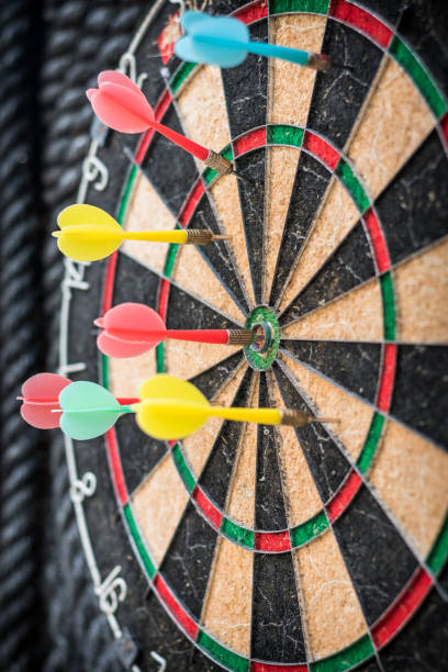 istock Target dart game with one win arrow hit on middle point spot and many missing for competitive business marketing concept 1179678178
