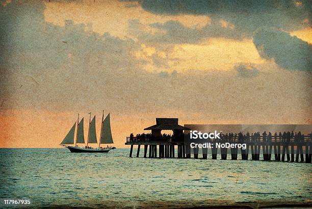 Vintage Sunset Pier Postcard With Sailboat Stock Photo - Download Image Now - Brown Paper, Cloud - Sky, Color Image