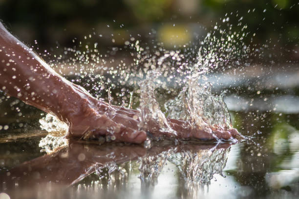 istock A man's hand hitting the water. 1179679416
