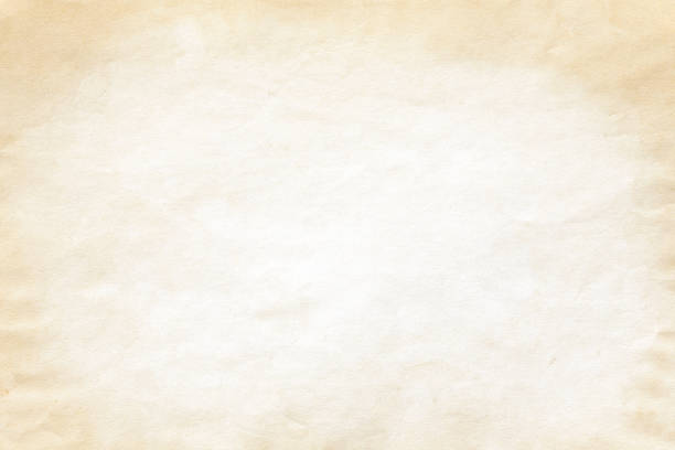 istock Old yellow crumpled paper background texture 1179679512