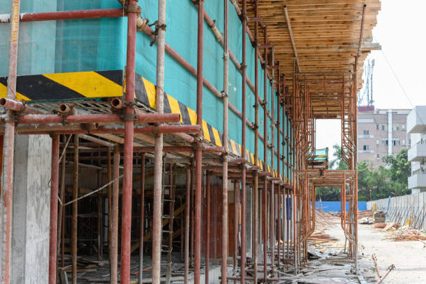 istock scaffolding and protection netting on an unfinished building 1179681190