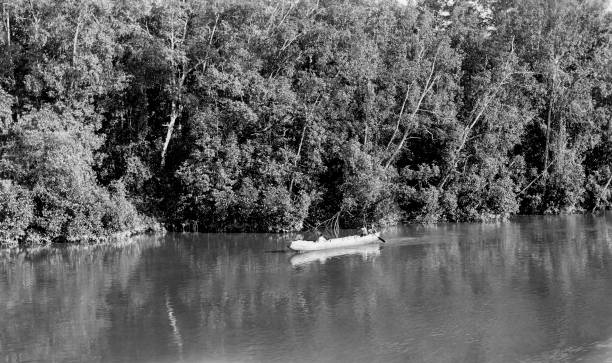 istock Men In Cutout Canoe On A River 1179686230