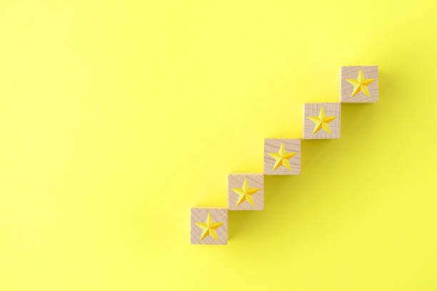 istock 5 stars assessment on yellow background 1179687033