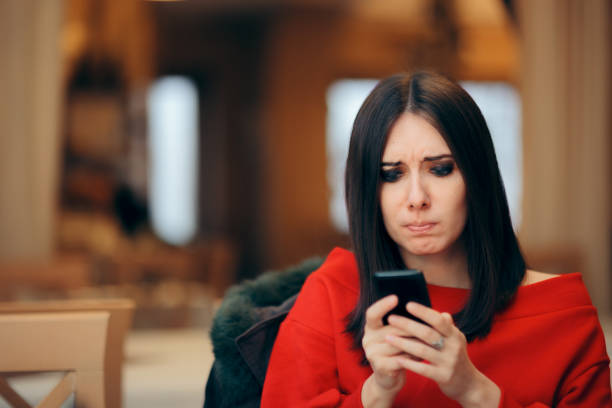 istock Stressed Woman Reading Text Message on Smartphone 1179691801
