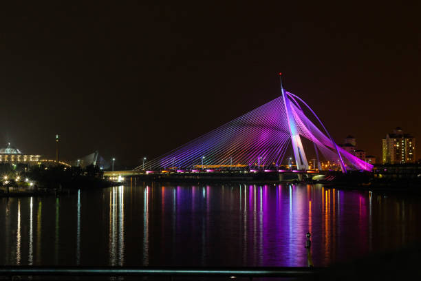 istock Putrajaya colourful bridge with light reflection on water 1179695821