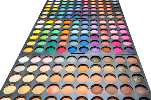 Palette with a multicolored eyeshadows on white background