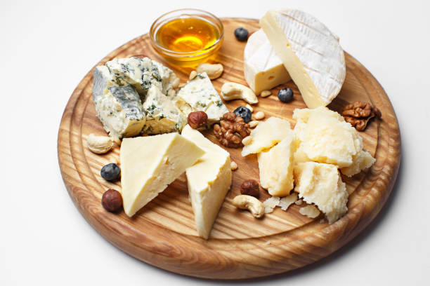 istock different cheeses sliced on wooden board 1179697394