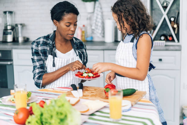 istock Mother and daughter in the kitchen 1179697405
