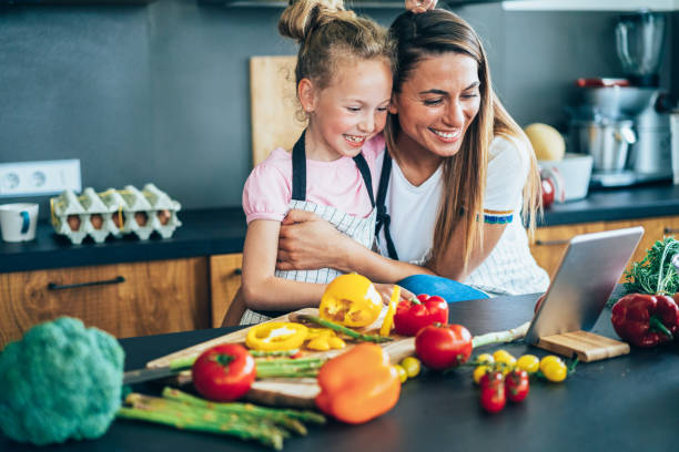 istock Mother and daughter in the kitchen 1179697417