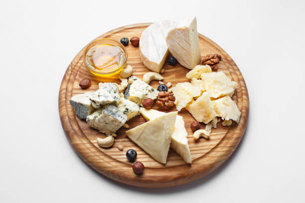 istock different cheeses sliced on wooden board 1179697499