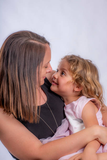 istock close contact between mother and 4 year old daughter. 1179706840