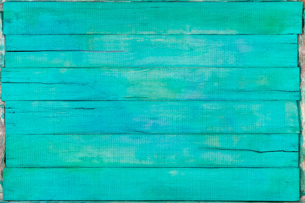 istock Weathered, subtle pastel, turquoise and blue colored wooden panel abstract background. 1179710695