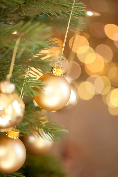istock Christmas Tree and Gold Lights Background 1179711524