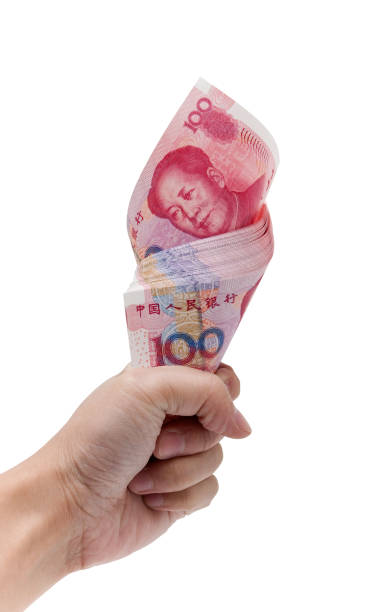 istock Holding Chinese Yuan Note (clipping path) isolated on white background 1179712530