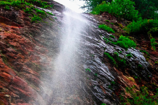 Water fall Himachal Pradesh-splashing Water fall on the head in shillong valley himachal pradesh on a shivling.
