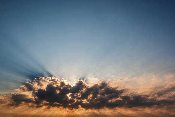 istock The sun behind the clouds with rays, morning photo with a beautiful background 1179715085