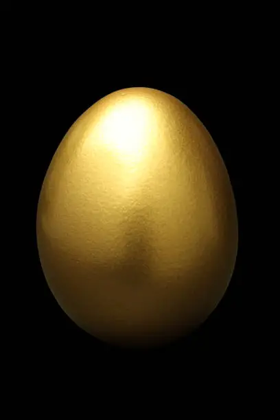 Photo of Gold Egg on Black Background