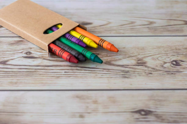 istock Box of colored pencils on a wooden background 1179718155