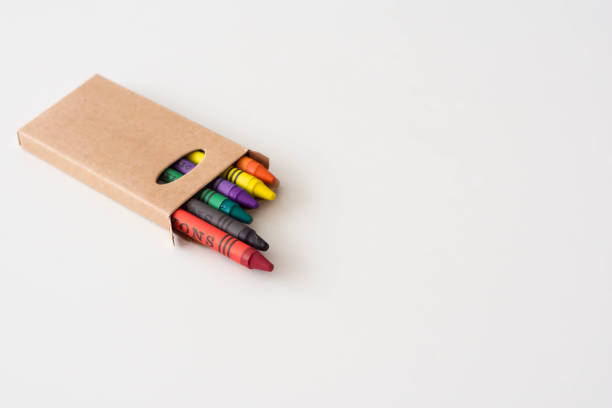 Box of colored pencils on a white background