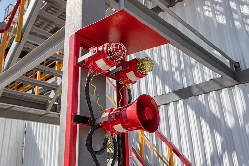 Alarm system consisting of a megaphone and two warning lights at the factory