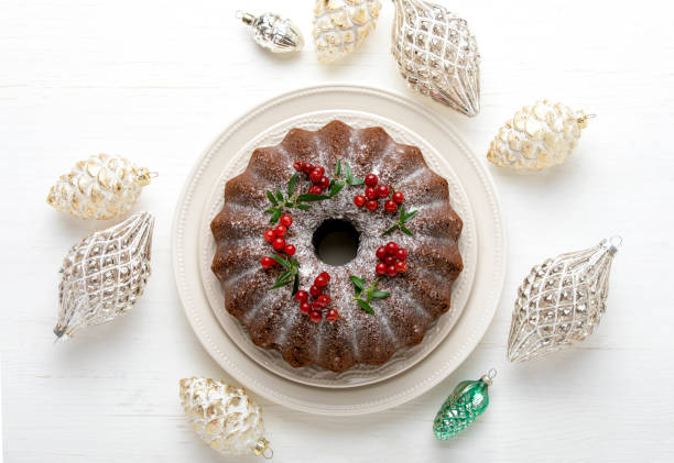 Christmas bundt cake with Xmas holiday decorations, top down view stock photo