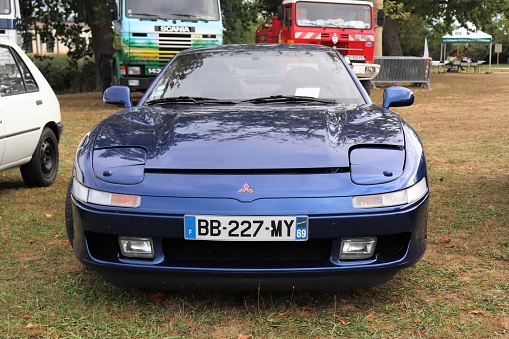 Mitsubishi 3000 GT 24B Bi Turbo - Sports car with 2 seats - Blue color - Year 1993 - Motor show in the town of Mornant - Rhone department on October 6, 2019 - Front of the vehicle