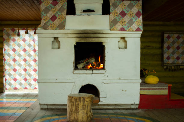 it is located the oven from a red brick in the house and serves for heating