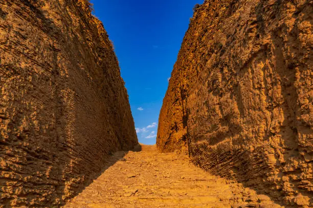 Photo of Narrow road between the rocks, way to paradise
