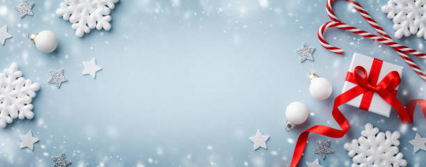 istock Christmas background with snow effect. Gift or present box, white snowflakes and holiday decoration top view. Happy New Year card. 1179720900
