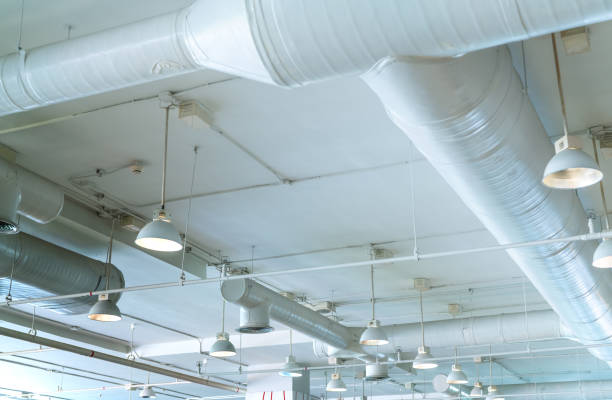 istock Air duct, air conditioner pipe, wiring pipe, and fire sprinkler system. Air flow and ventilation system. Building interior. Ceiling lamp light with opened light. Interior architecture concept. 1179722132