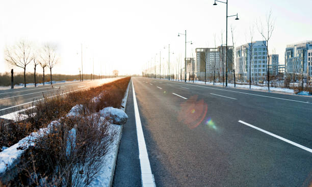 Empty street and modern building in winter.