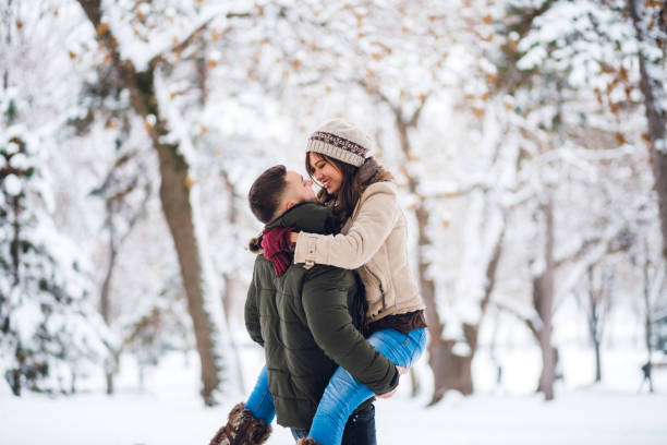 istock Young couple in the snow 1179728583