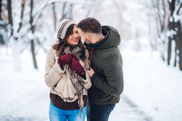 istock Young couple in the snow 1179728702