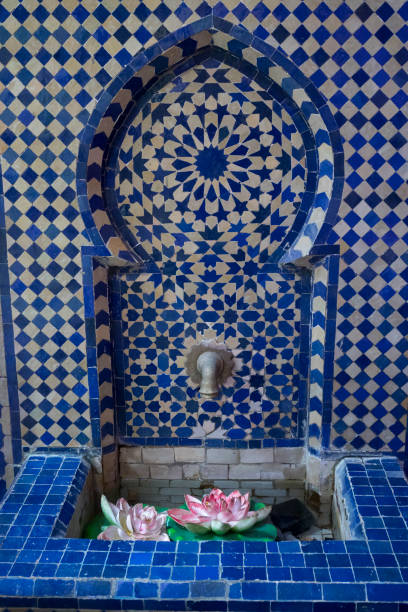 Beautiful water fountain decorated with moroccan tiles in Asilah, Morocco