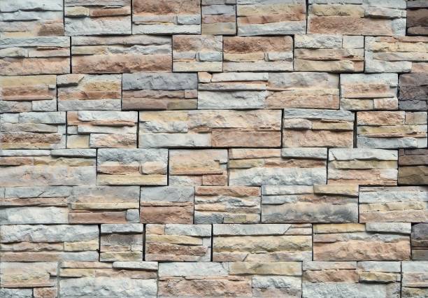 istock Stoneware panels cladding with stone effect for exterior walls. Colors are gary and brown 1179729615