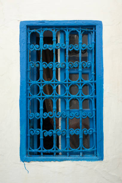 istock Traditional Moroccan window protected with blue metal railing 1179729632