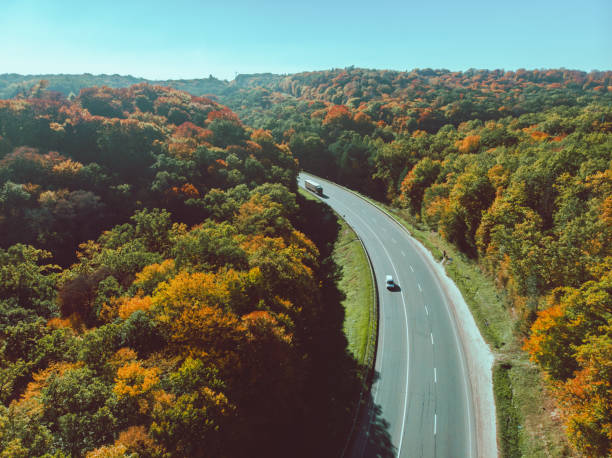 istock aerial view of autumn highway in forest copy space 1179731049