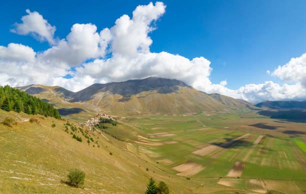 Castelluccio di Norcia, 2019 (Umbria, Italy) The famous landscape highland of Sibillini Mountains, during the autumn, with the small stone village destroyed by a recent earthquake fiels stock pictures, royalty-free photos & images