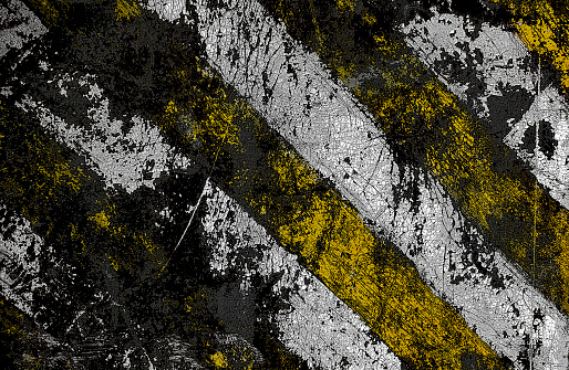 Striped damaged texture with cracks and white-yellow stripes.Post-apocalyptic background with colorful stripes. Destroyed sign dimensional transport with cracks and spots.
