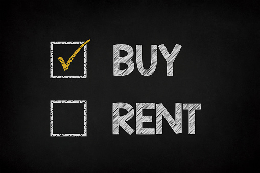 Buy or rent concept on chalkboard