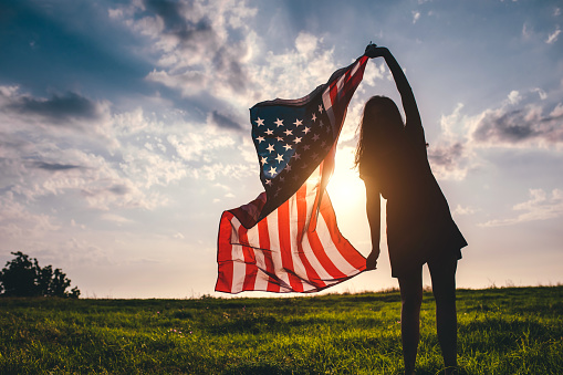 American Flag Blowing in the Wind at Sunset