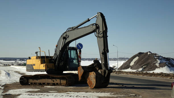 istock Excavator on the construction site. Against the blue sky. 1179732847