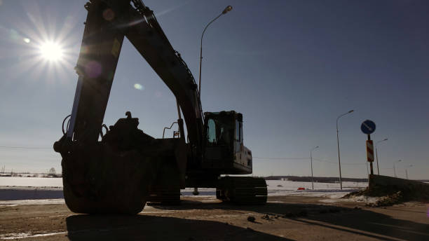 istock Excavator on the construction site. Against the blue sky. 1179732910