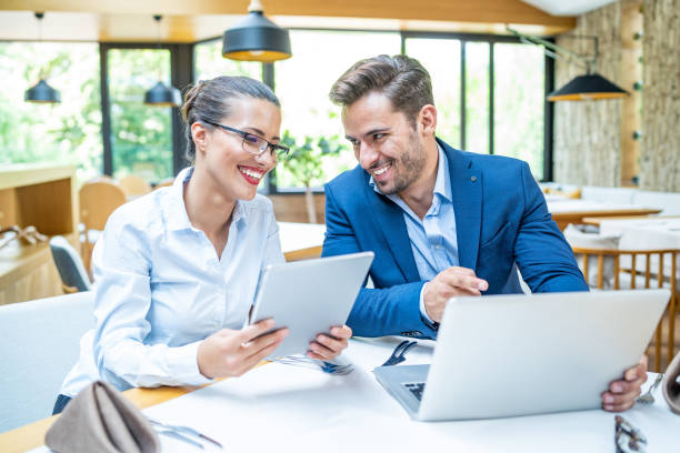 istock Coworkers talking and working in restaurant 1179733936