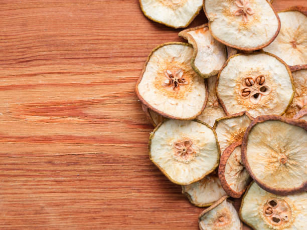 Dried Pears on an old wooden table, top view
