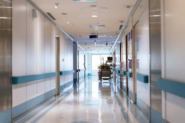 Blurry image of hospital corridor in front of Operation rooms.Hospital blur background with Nurse.