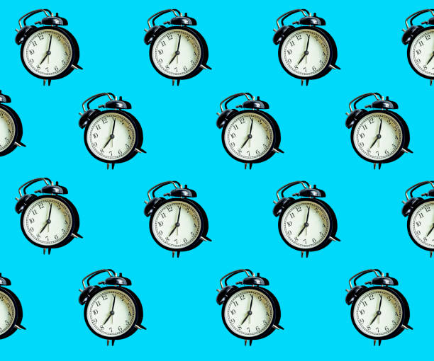 istock Vintage alarm clock on a blue minimal background. Time management and time concept 1179735384