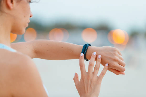 istock Touching the fitness tracker on her wrist 1179735929