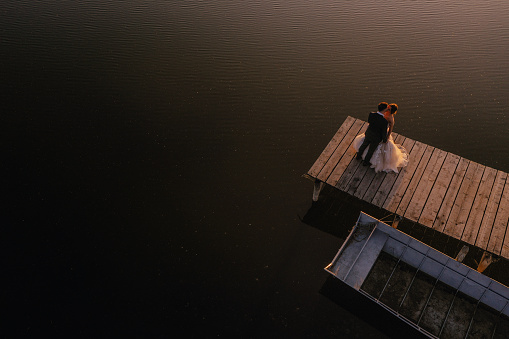 Romantic moment of married couple at the lake